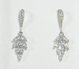 Cubic Zirconia sparkling leaf dangle earrings with rhodium-plated hooks.