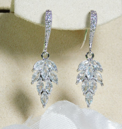 Cubic Zirconia leaf dangle earrings with sparkling CZ and rhodium-plated hooks.
