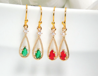 Gold-plated drop earrings with CZ stones and red or green glass teardrops.